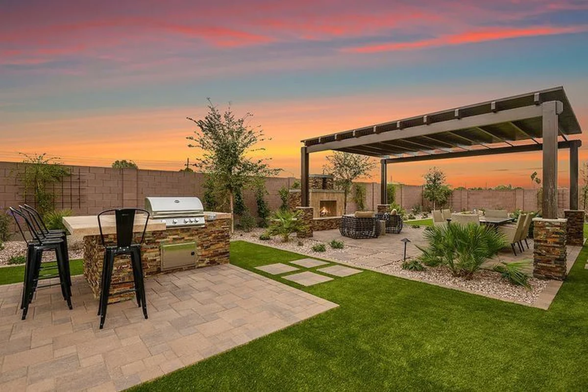 Paver patio installation with clean border lines and outdoor seating area